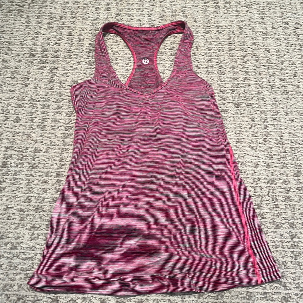 Lulu lemon striped pink shirt, size 4, lightly used and in great condition.
